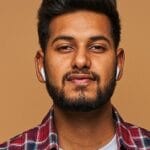 men wear red shirt and hear music with airports